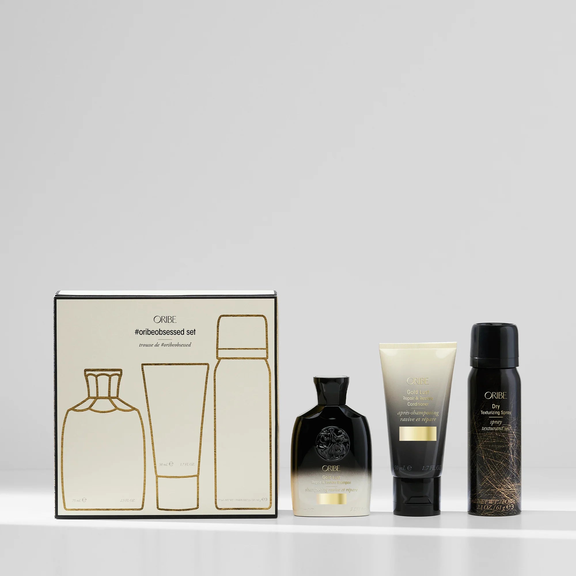 Oribe Obsessed Set - Oribe Gold Lust Repair & Restore Shampoo, Oribe Gold Lust Repair & Restore Conditioner, Oribe Dry Texturizing Spray